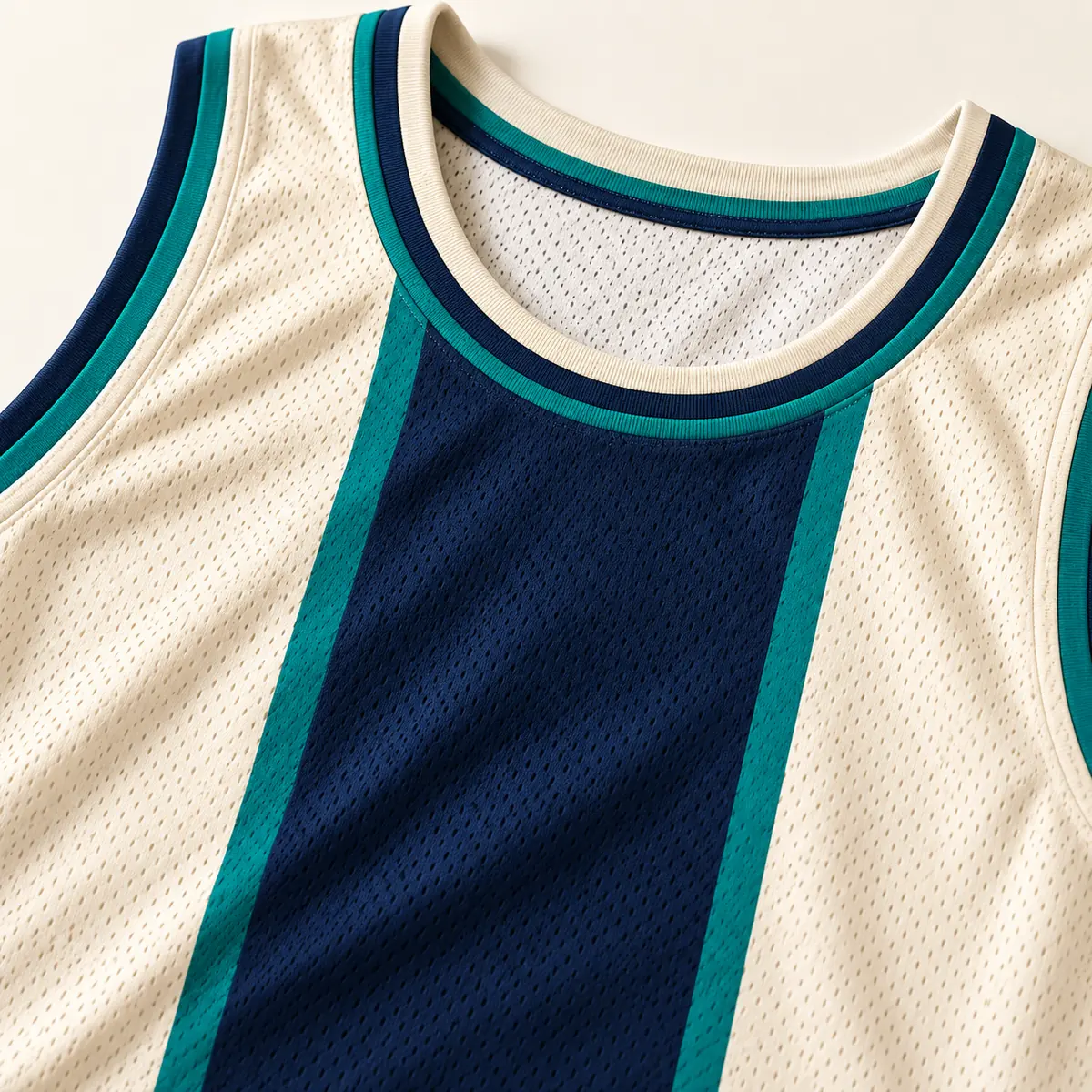 Detail mockup of a cream basketball jersey in the Sandstone Swish design