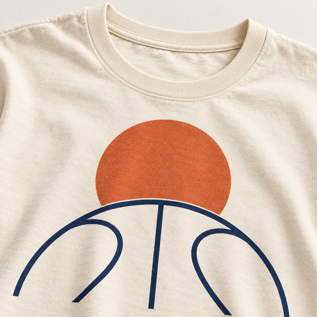 Detail mockup of a cream crew neck T-shirt in the Game Circle design